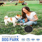Woman sitting on grass with a dog, both drinking from a blue water bottle, with 'Dog Park' branding.
