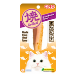Cat treat package with grilled dried bonito flavor, featuring a white cat on an orange background.
