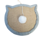 Cat-shaped scratching pad with a white pom-pom on a beige background