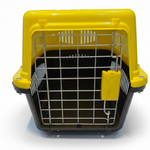 Yellow and black pet carrier with a wire bottom on a white background