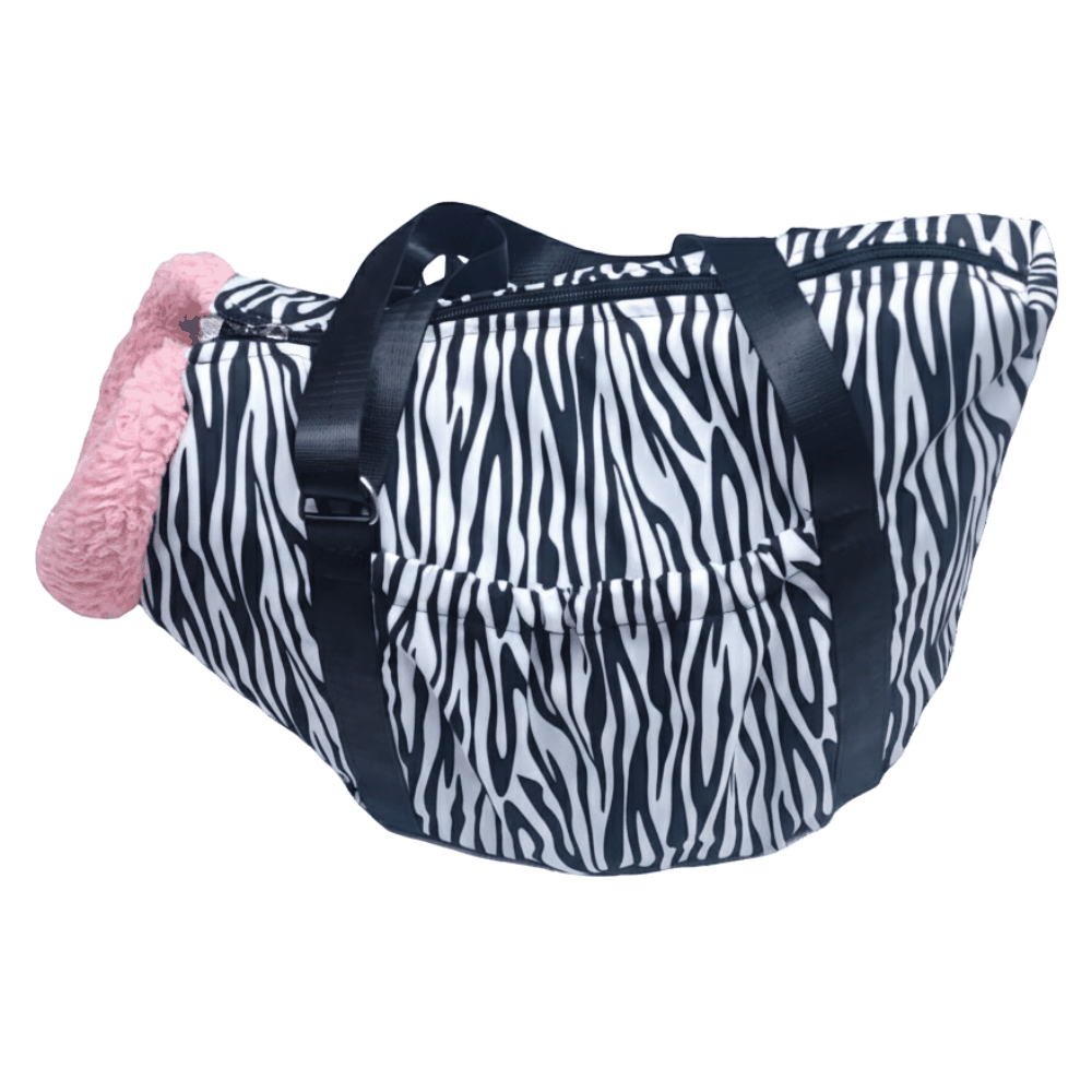 Zebra print bag with a pink item on a white background