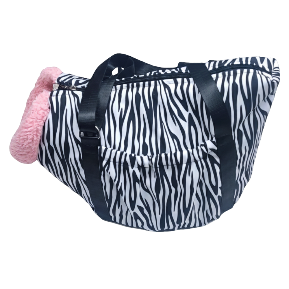 Zebra print bag with a pink item on a white background
