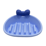 Blue soap dish with a bow on a white background