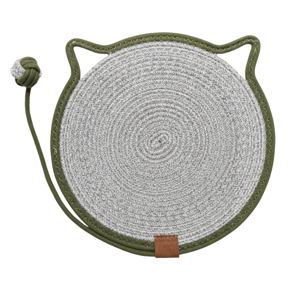 Round woven mat with cat ears and a string on a white background