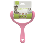 Pink pet grooming tool with a label on a white background