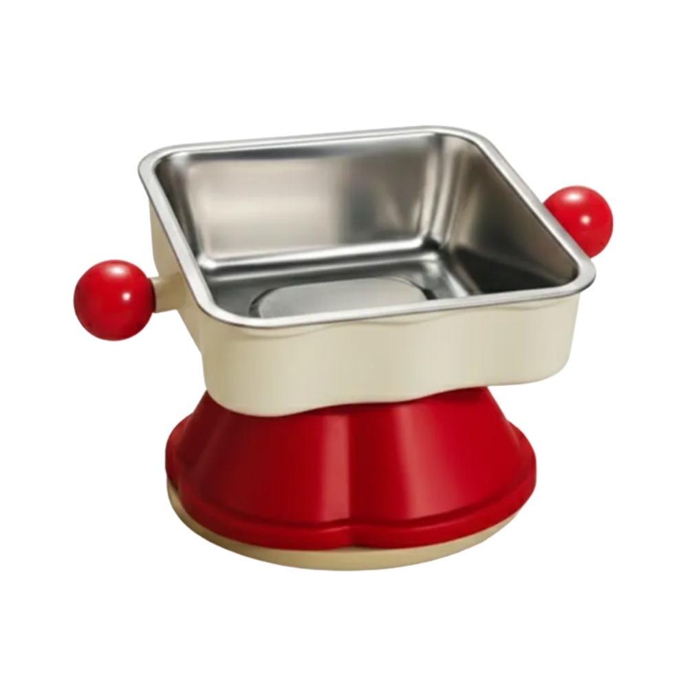 Small metal pan with red handles and base on a white background
