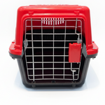 Red and black pet carrier on a white background