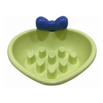 Green pet toy with a blue ball on a white background