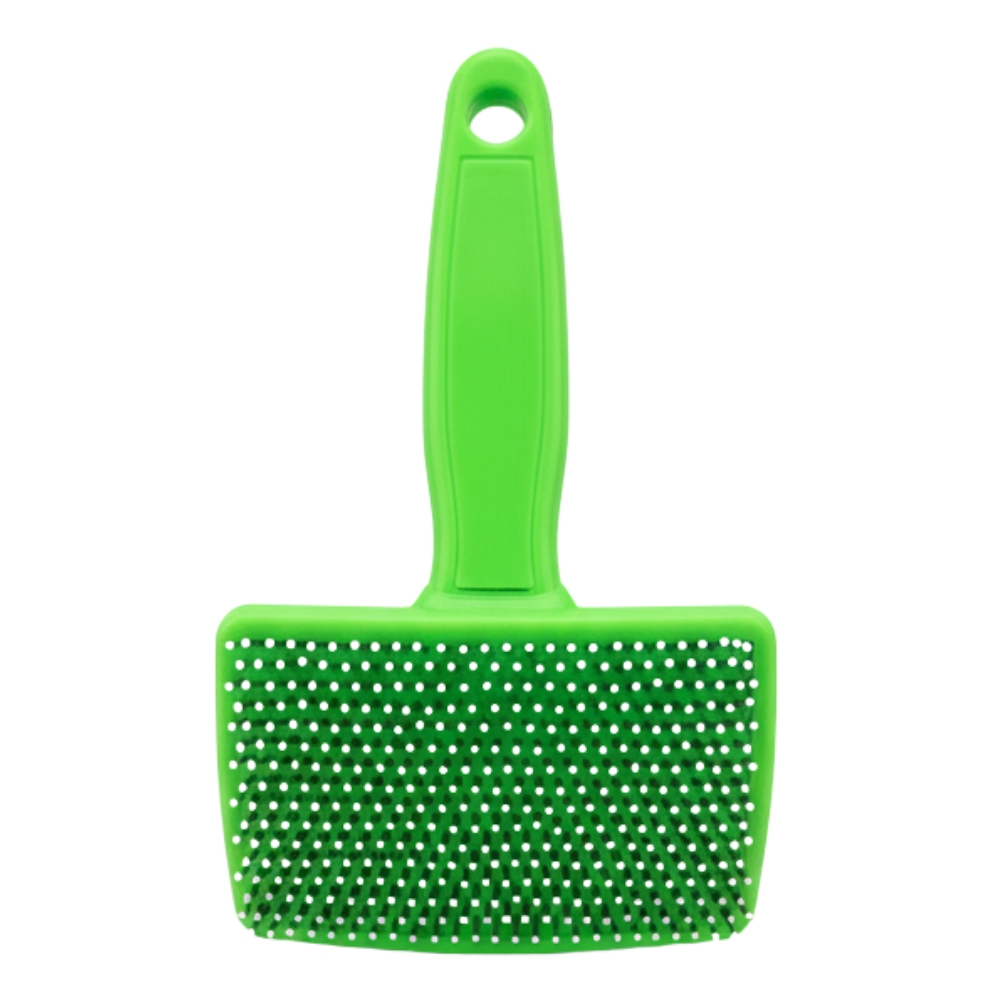 Green pet grooming brush with a white background