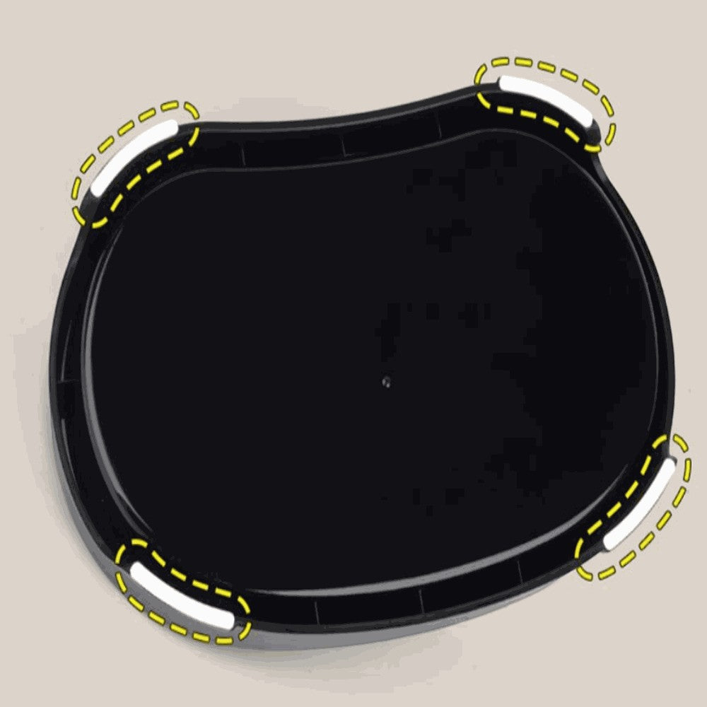 Black plastic tray with white handles on a beige background