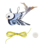 Toy bird with a string and suction cup on a white background