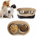 Pet bowls for a dog and cat with food on a white background