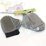 Two gray grooming gloves with black undersides, still in packaging, on a white background.