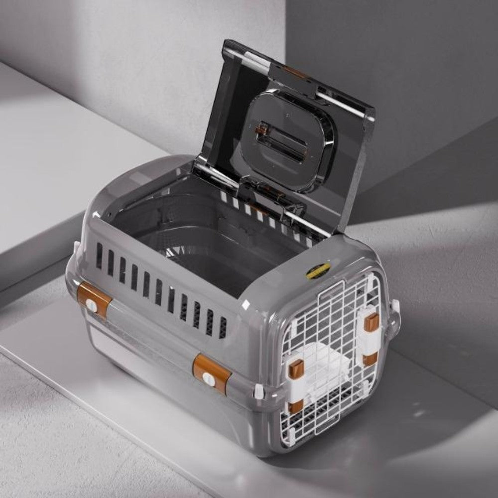 Gray pet carrier with open lid on a light gray surface