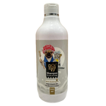 Dog shampoo bottle with a label featuring cartoon dogs on a wooden surface.