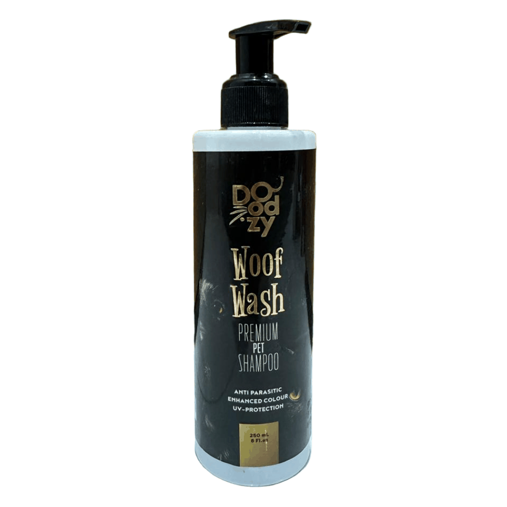 Doggy Woof Wash premium pet shampoo bottle on a tiled floor with wooden wall background