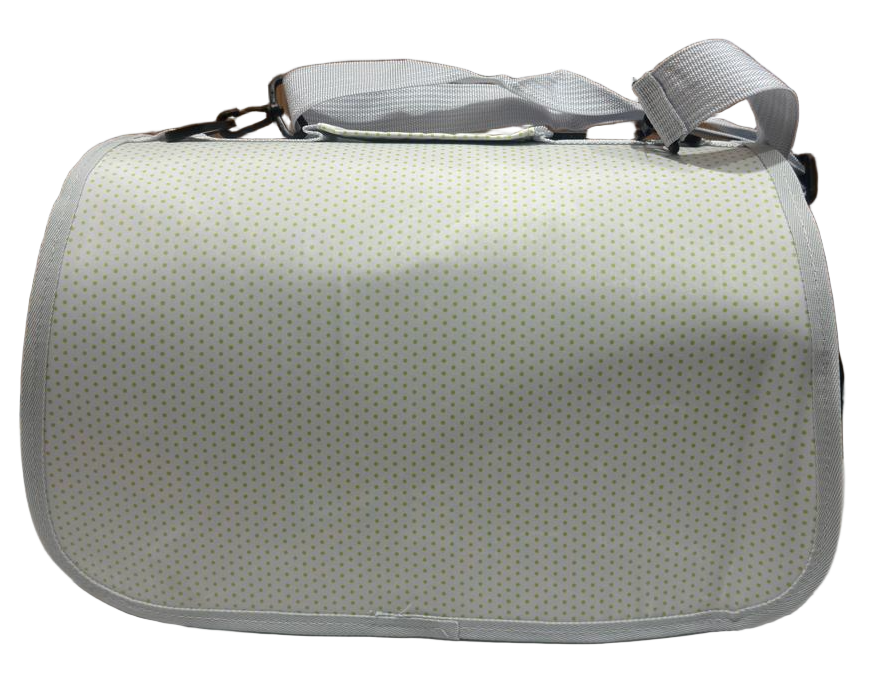 Light gray textured bag on a tiled floor with a wooden wall in the background