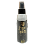 Bottle of Puppy Trainer spray on a tiled floor with wooden wall background