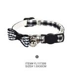 Pet collar with bow and bell on a white background
