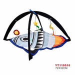 Colorful shark-shaped toy with hanging elements on a white background