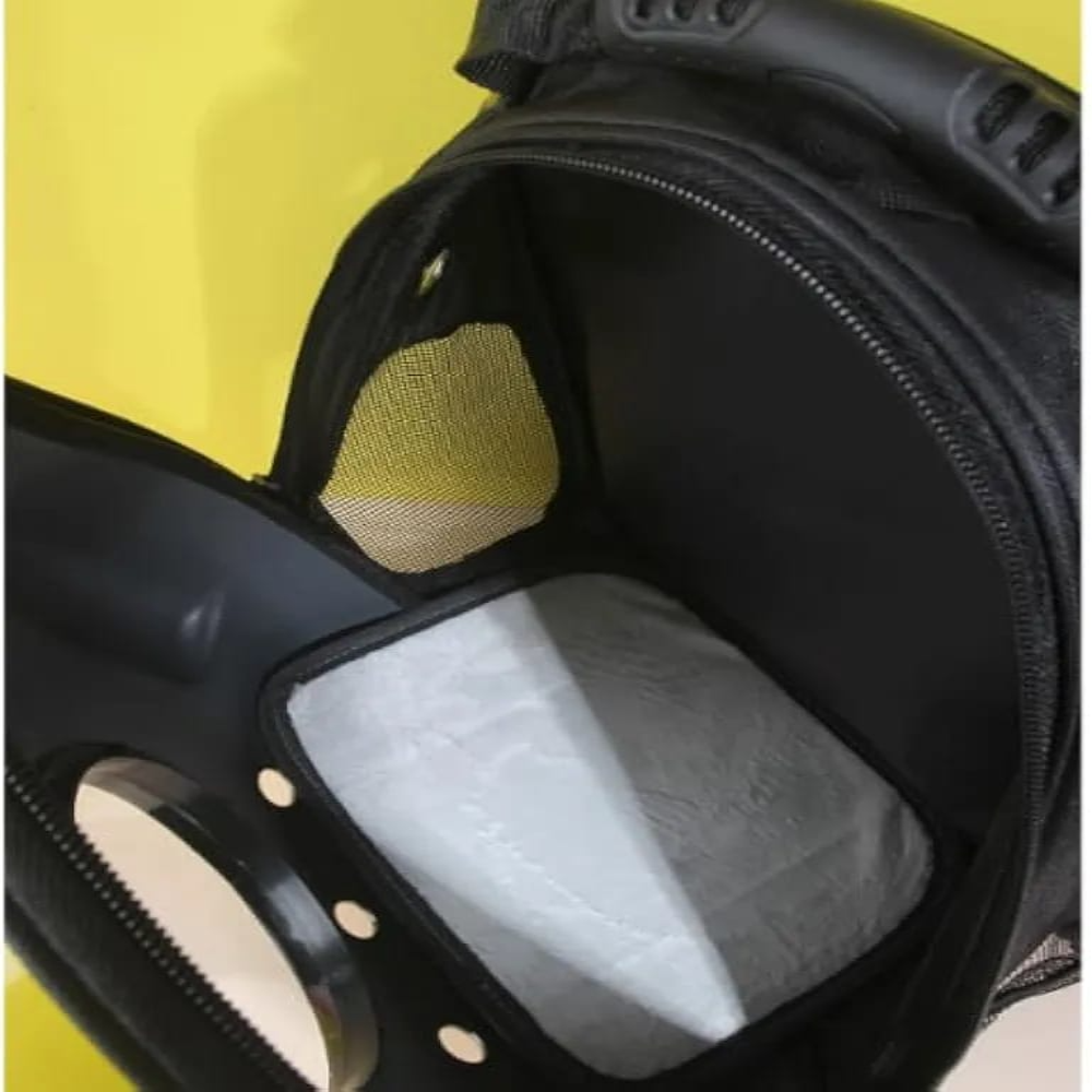 Close-up of a helmet interior with a yellow patch and white padding.