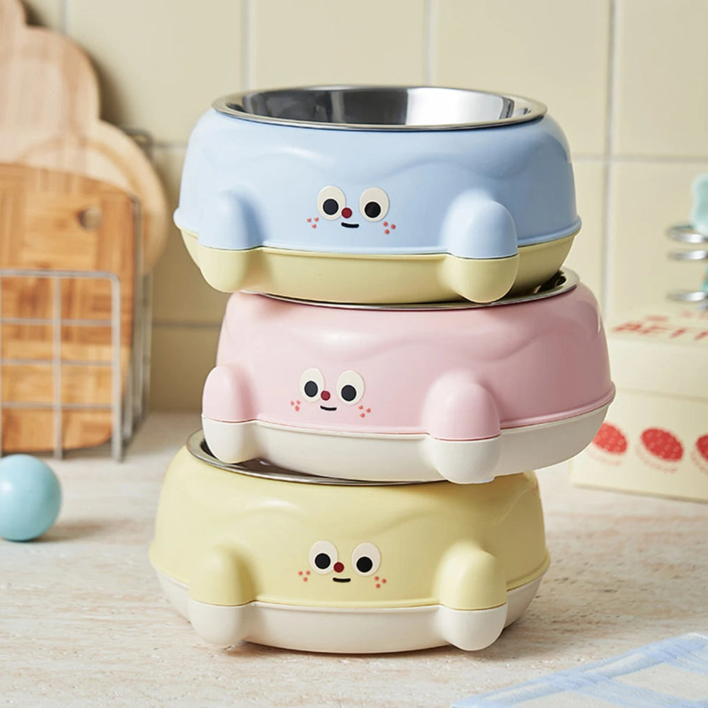 Stack of colorful cartoon-style bowls on a wooden surface