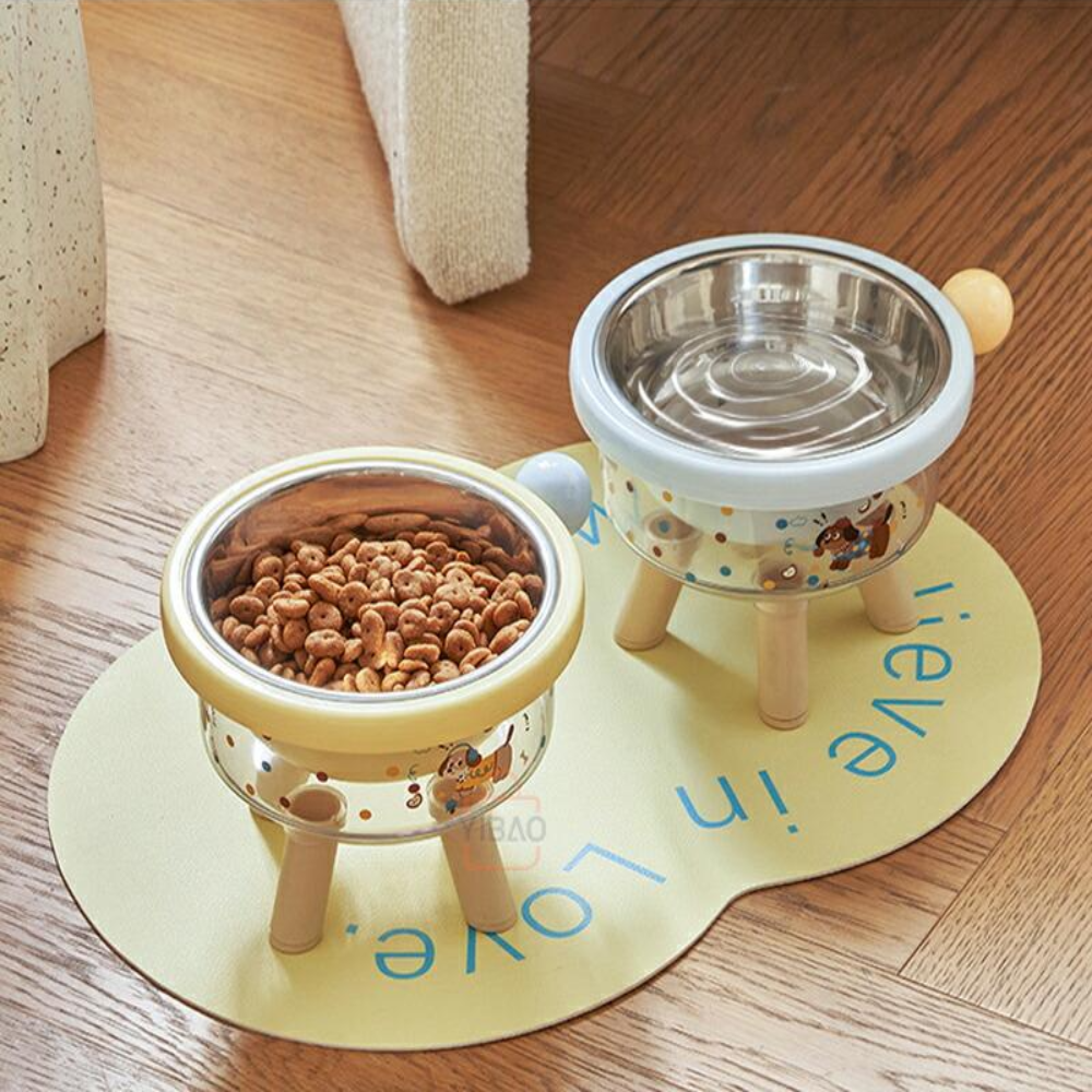 Pet feeding bowls with wooden stands on a wooden floor