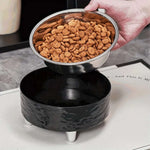 Black pet water bowl with a metal bowl of dog food on top