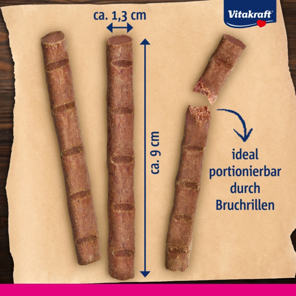 Dog chew sticks with measurements and Vitakraft branding on a brown background