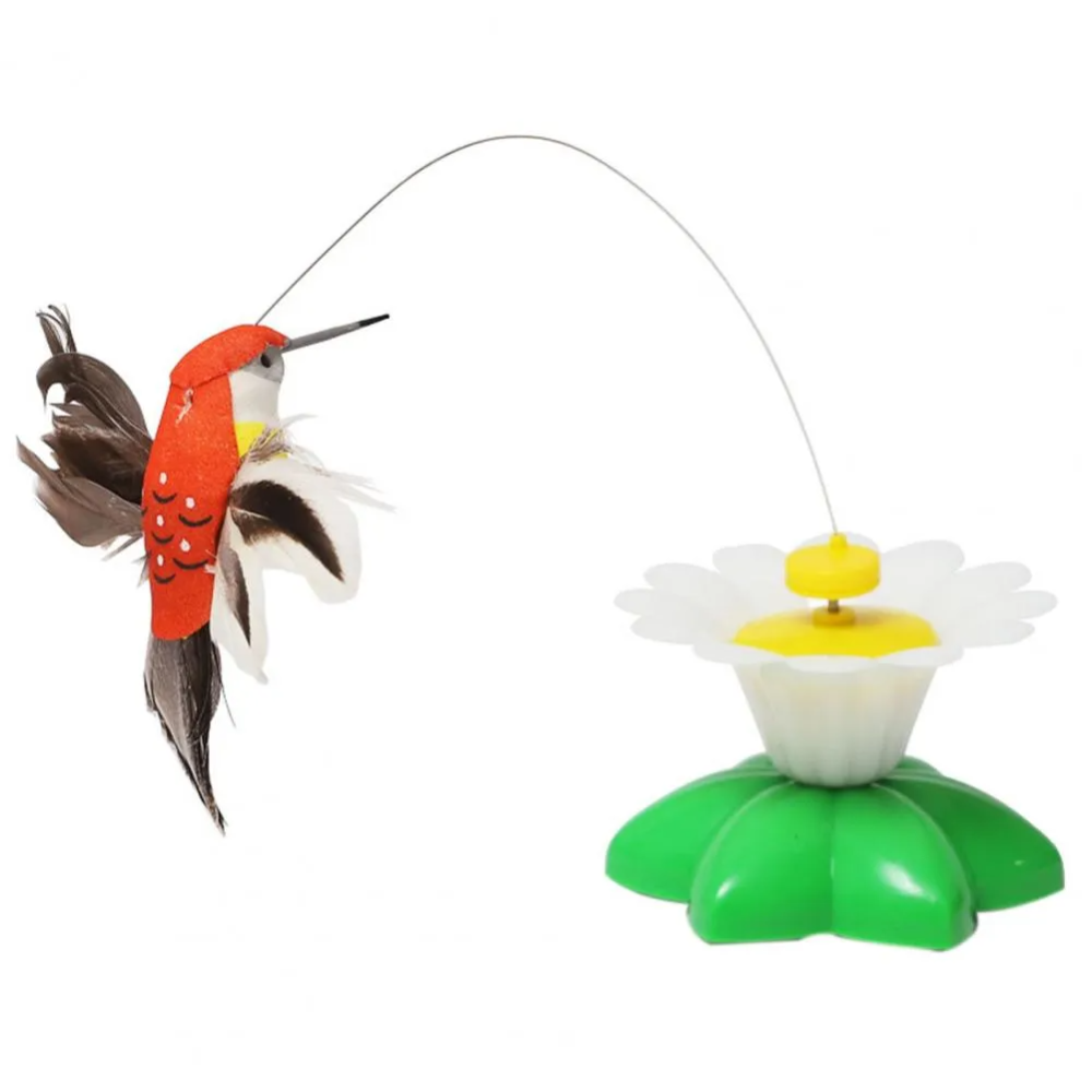 Toy hummingbird and flower on a white background
