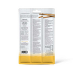Clear packaging with yellow base containing text and two wooden sticks on a white background