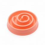 Peach orange spiral slow feeder bowl white background