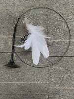 Interactive cat toy steel wire with feather.