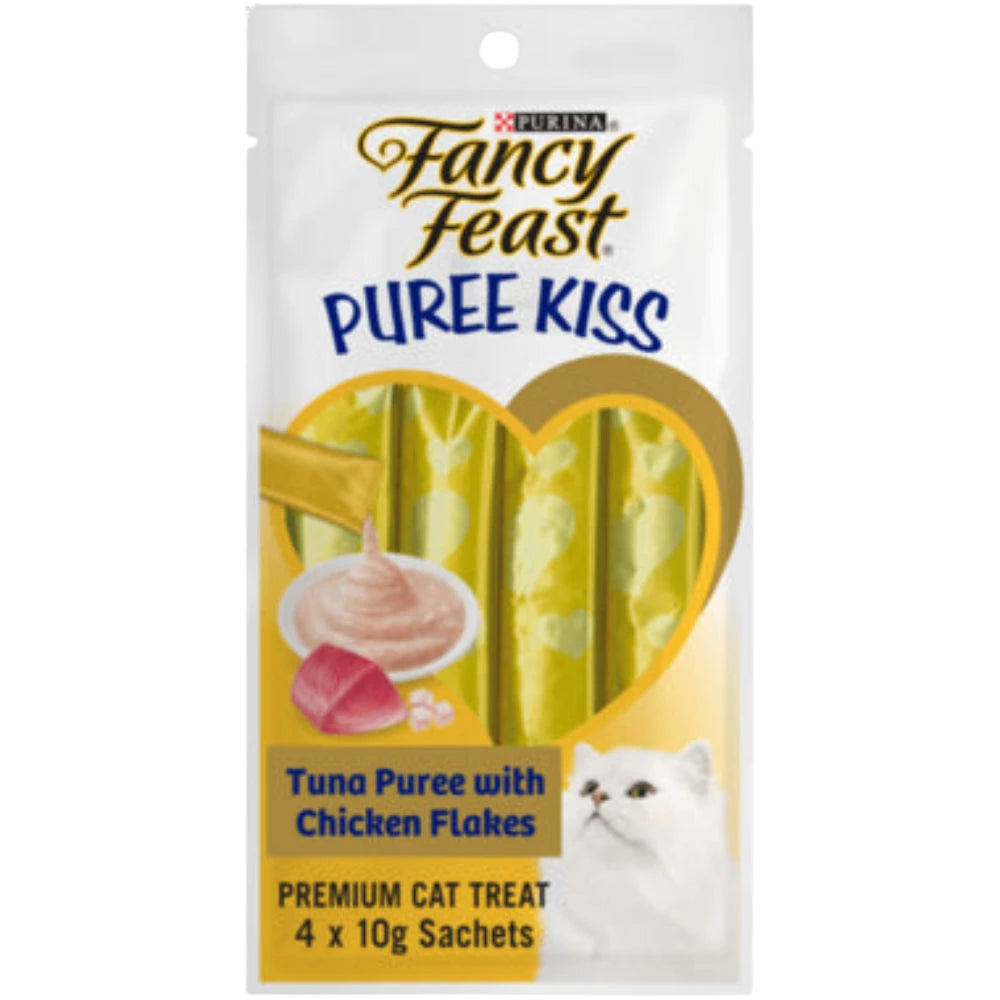 Fancy Feast Puree Kiss cat treat package with tuna puree and chicken flakes on a white background