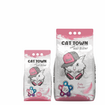 Two packages of Cat Town cat litter with cartoon cat design on a white background
