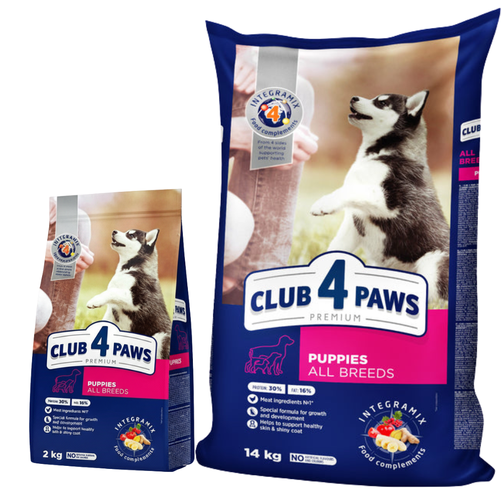 Two packages of Club 4 Paws dog food for puppies on a white background