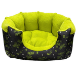 Green pet bed with black patterned exterior on a white background