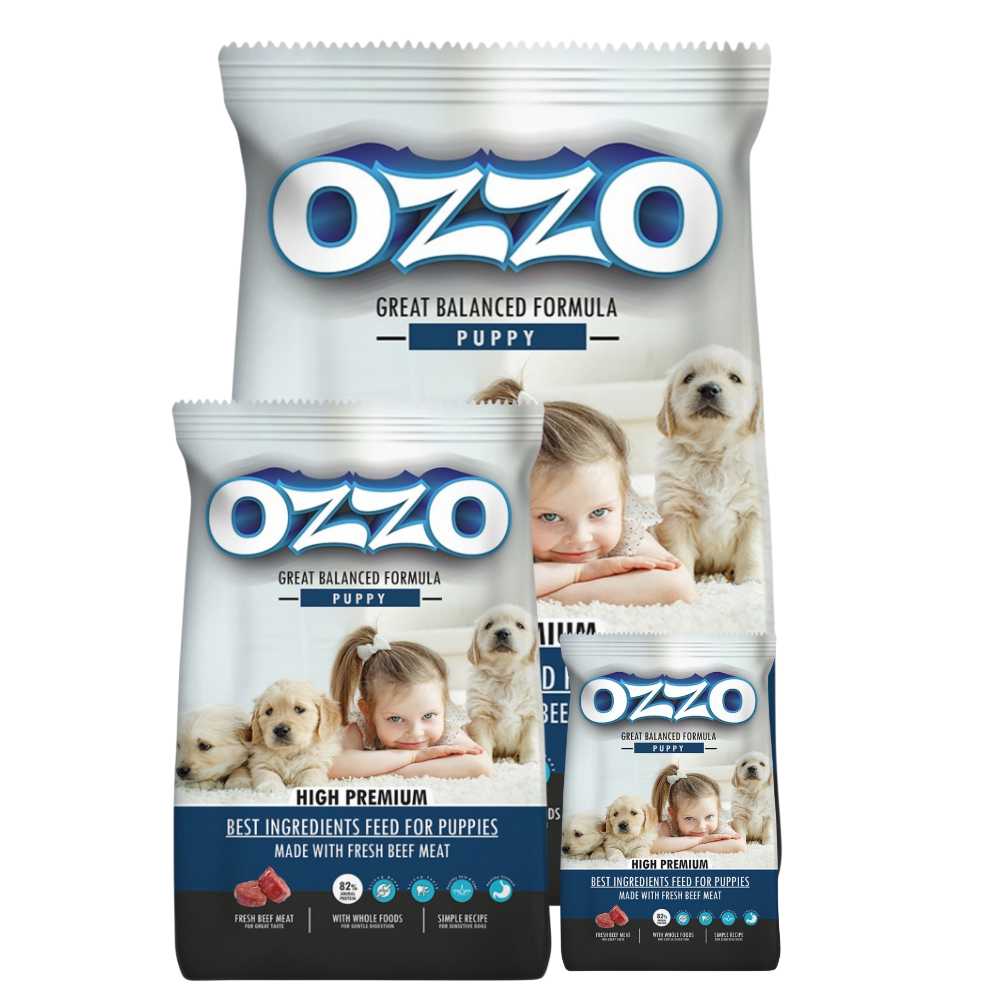 Three packages of OZZO puppy food with images of puppies and children on a white background.