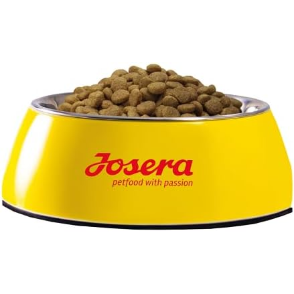 Yellow pet food bowl with Josera petfood on a white background