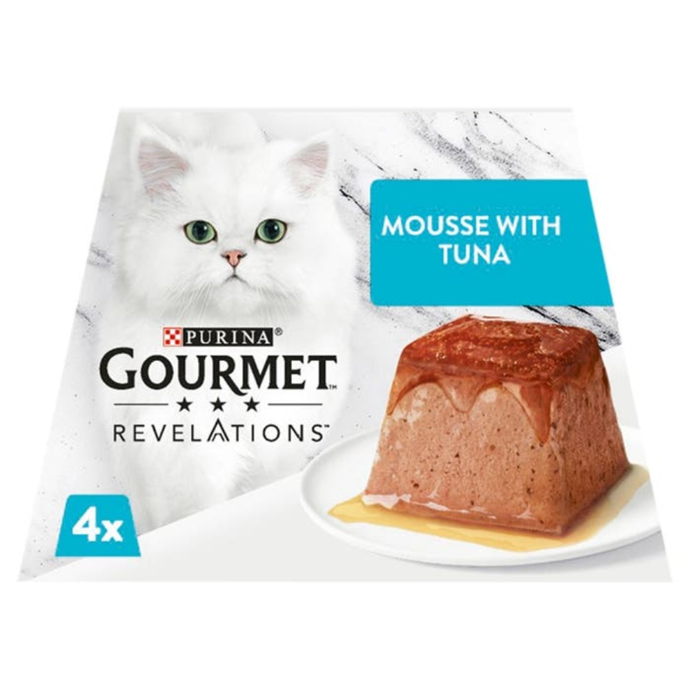 Gourmet Revelations cat food package with a white cat and tuna mousse on a marble background
