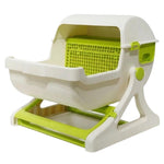 White and green pet carrier with open door on a white background