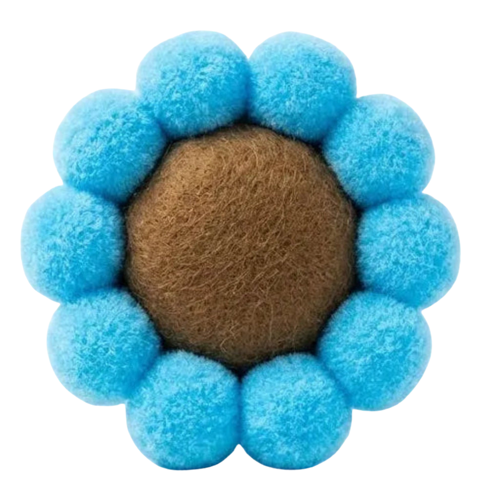Pet toy with blue fuzzy balls around a brown center on a white background